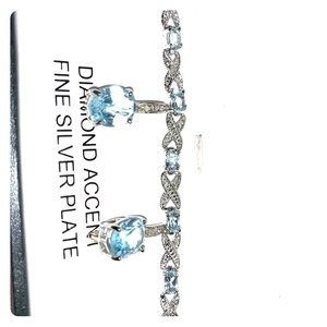 Macy’s Aquamarine and diamond bracelet earring set